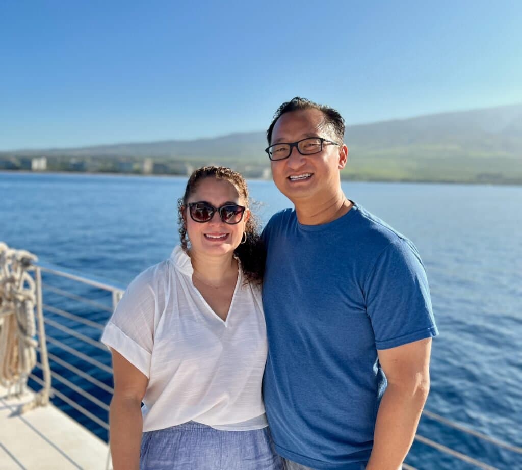 Louis and Kristine Trinh, founders of LahainaOceanfrontRentals, on a boat off the coast of Maui
